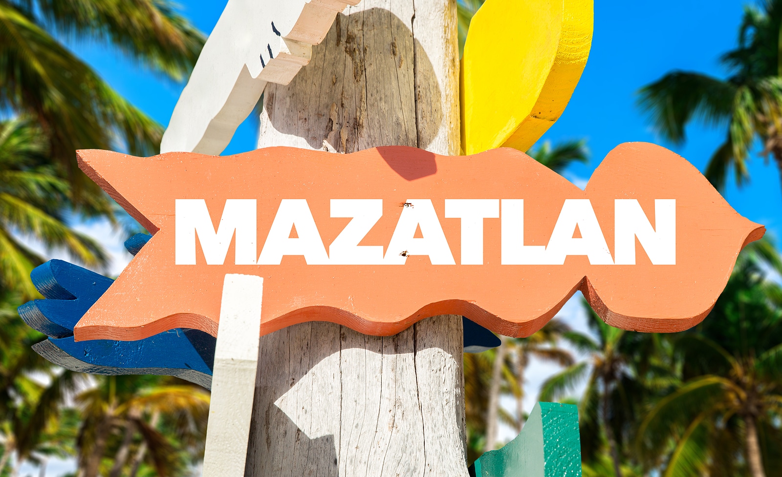 Mazatlan welcome sign with palm trees